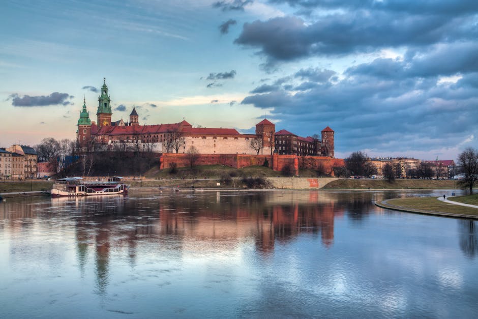 Evening view of the Vistula River with Wawel Castle illuminated