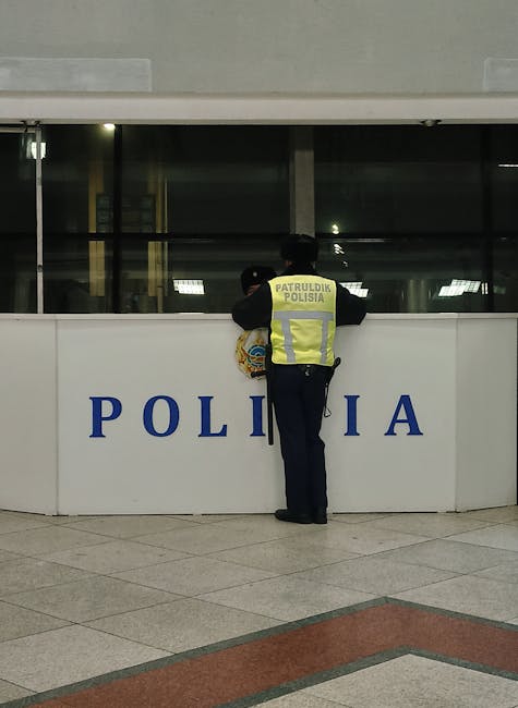 Tourist reporting a theft at a Krakow police station at night