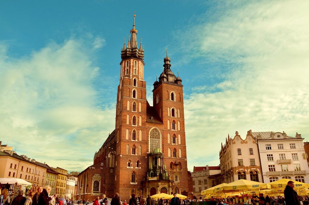 Commemorative column in a sunny Kraków square