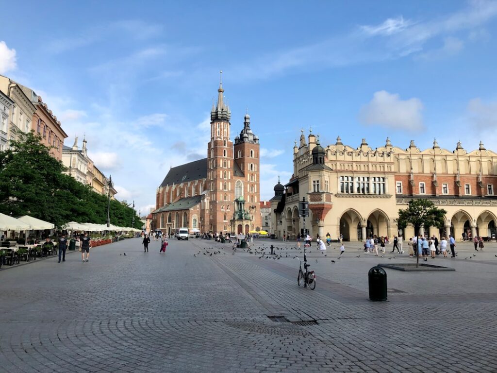 Main Market Square with morning tourists and cyclists
