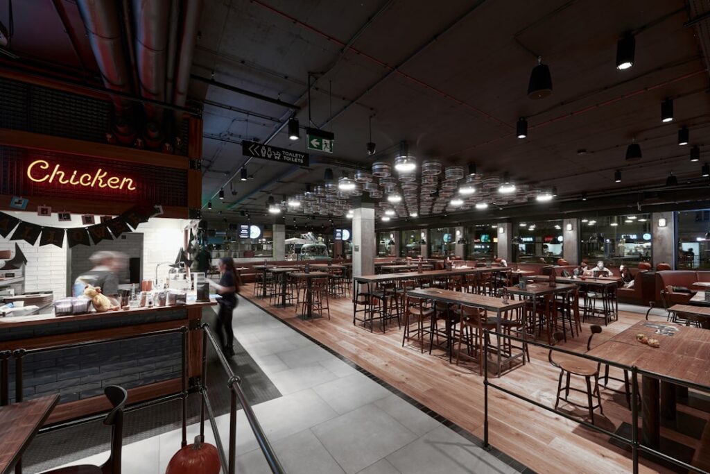 Busy Warsaw milk bar interior with trays and traditional dishes