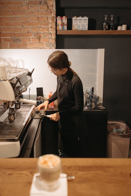 Cozy specialty coffee shop interior in Żoliborz, barista at work