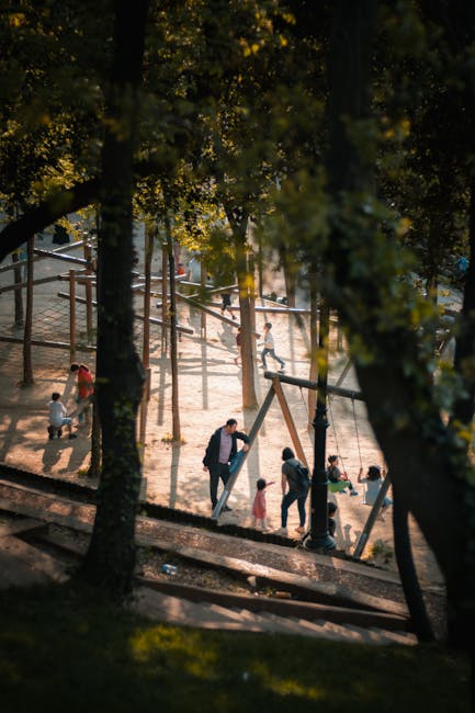 Family walking in Park Żeromskiego, playground scene