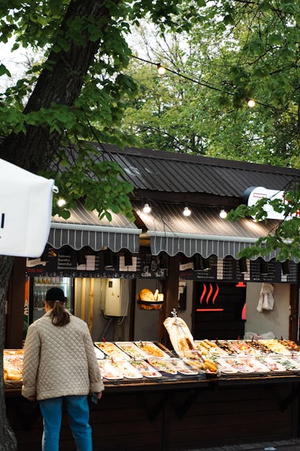 Koszyki market food court with colorful stalls and people eating