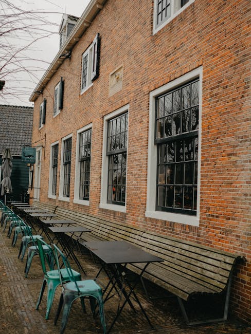 Old Town pierogi restaurant exterior with wooden benches and customers