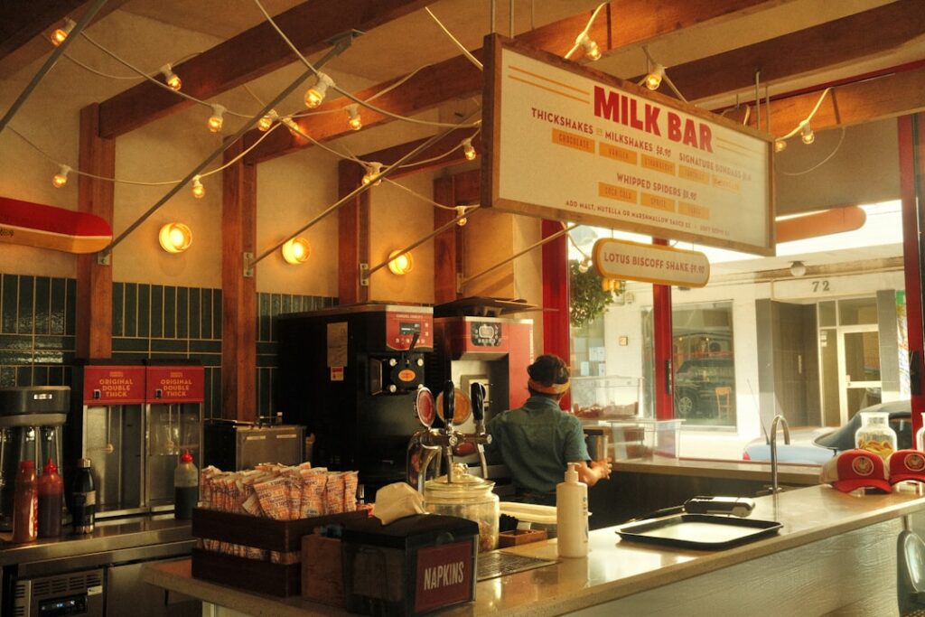 Traditional Polish milk bar counter with plates and customers