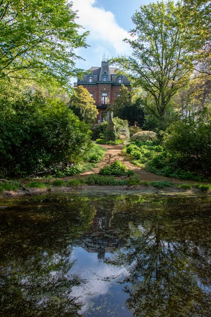 Anin manor house reflected in the park pond