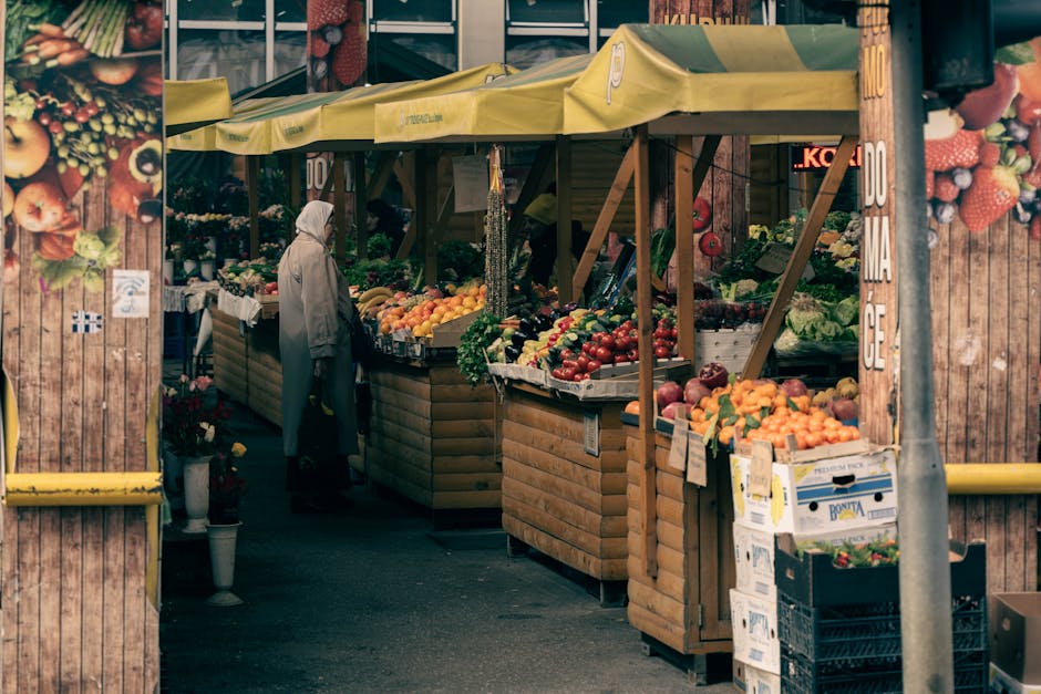 Morning at Hala Mirowska with crowded fresh produce stalls
