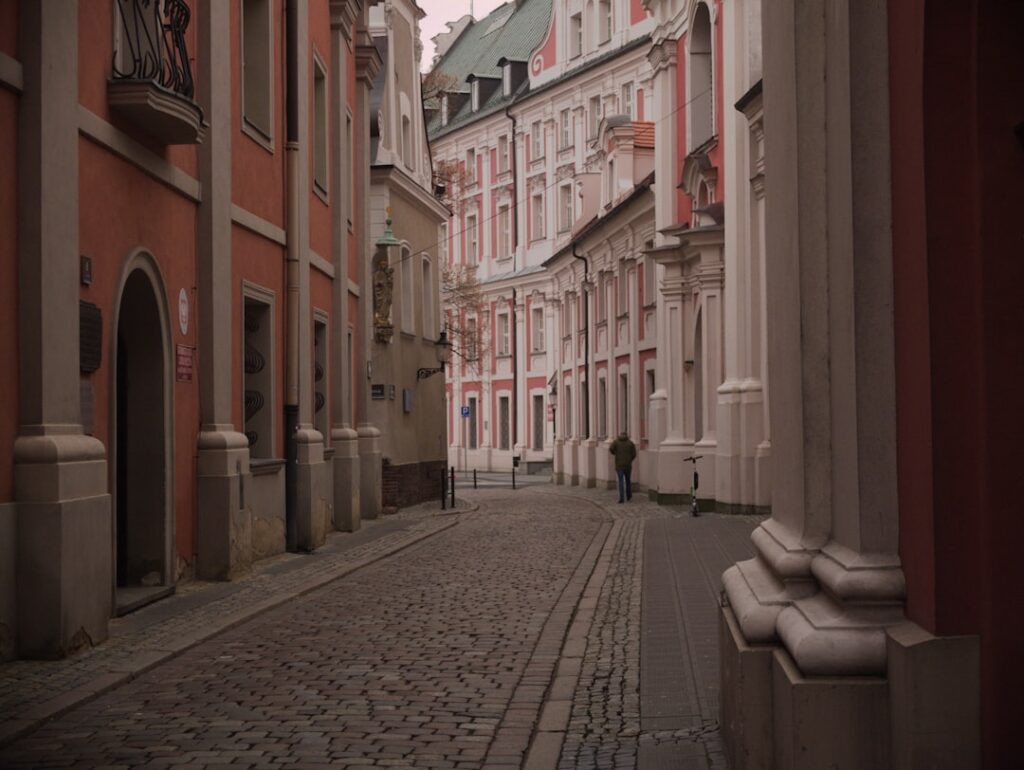 Tree-lined street with historic buildings in Żoliborz Oficerski
