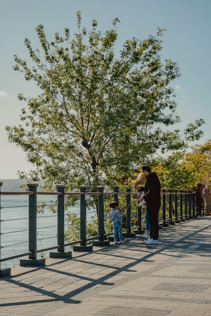 Family walking along the lakeside promenade