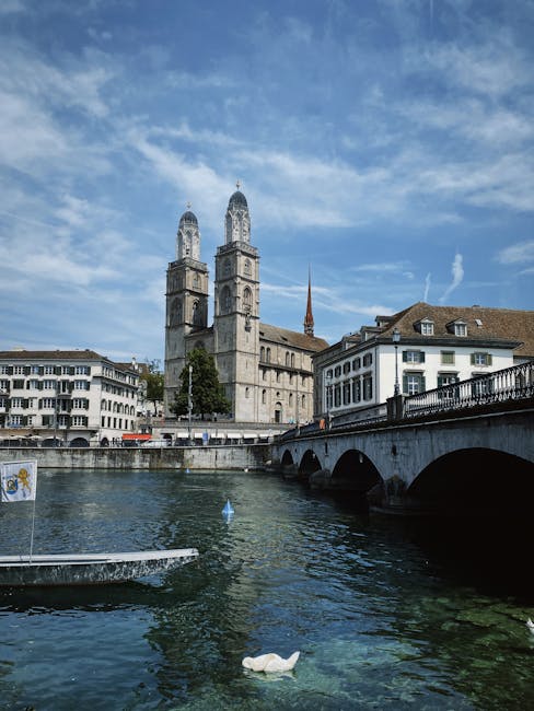 Grossmünster church towers viewed from the Limmat river at midday