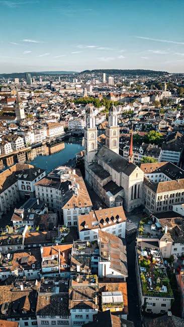 Swissôtel Zurich rooftop pool with city view at dusk