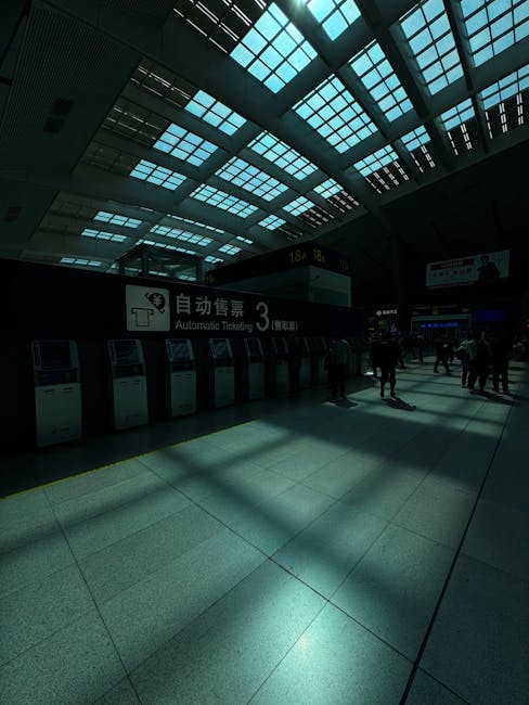 Busy station concourse in Lucerne with ticket machines