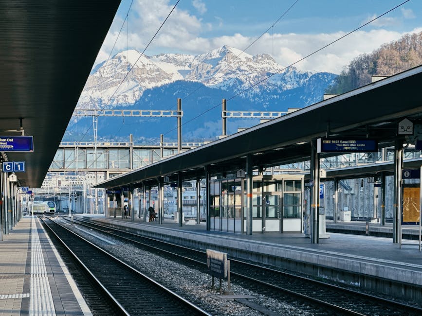 Exterior view of Lucerne railway station with mountains in the background