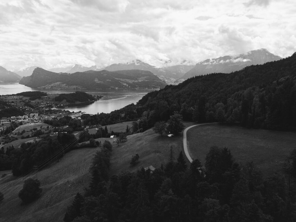 Regional Swiss train winding through mountain valley near Lucerne