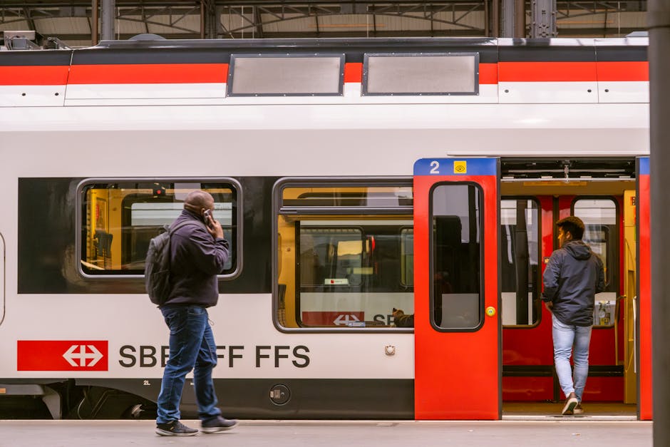 Visitor holding travel documents inside Lucerne train station