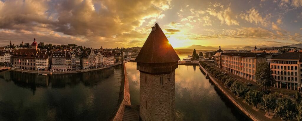 Chapel Bridge in Lucerne at golden hour reflecting on the Reuss River