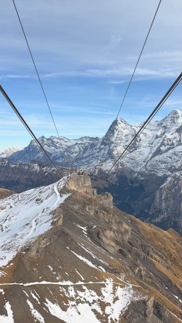 Cable car ascending over the valley to Schilthorn
